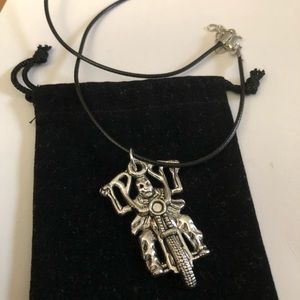 Skeleton riding a motorcycle w/ape hangers, on a 18” leather necklace